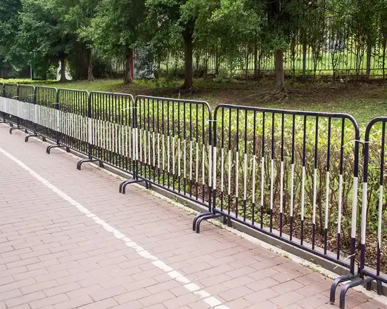 Portable barrier used for managing pedestrian flow.
